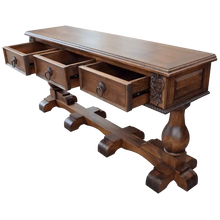 Load image into Gallery viewer, Handcrafted Spanish colonial console with carved scrollwork, twist rope details, forged iron pulls, turned pedestals, and customizable solid wood construction.
