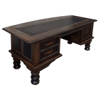 Handcrafted executive desk with crocodile-embossed leather panels, twisted rope molding, and solid wood base. The Puro Rancho Desk embodies Western luxury and artisanal craftsmanship.