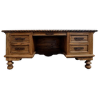 Hand-carved Western executive desk with longhorn motif, floral details, and multiple drawers. The San Benito 2 Desk combines craftsmanship, storage, and timeless Western elegance.