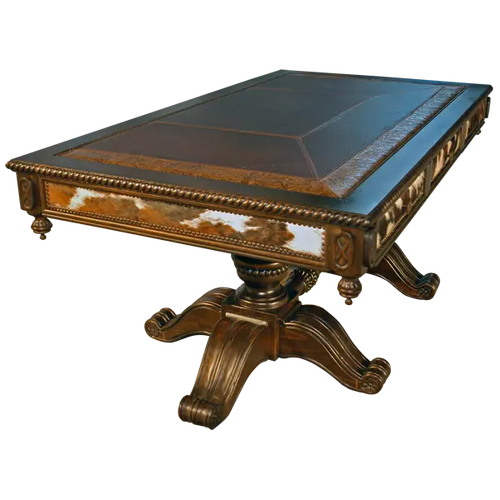 Handcrafted Western executive desk featuring cowhide panels, leather inlay, and hand-carved pedestal base. The Castellano 2 Desk unites bold Western style with refined craftsmanship.