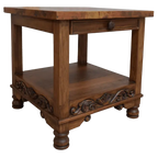 Handcrafted end table with hand-hammered copper top, floral carvings, and bun feet. The DuPont End Table blends Western character with timeless, artisanal craftsmanship.