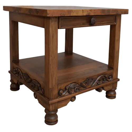 Handcrafted end table with hand-hammered copper top, floral carvings, and bun feet. The DuPont End Table blends Western character with timeless, artisanal craftsmanship.
