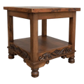 Handcrafted end table with hand-hammered copper top, floral carvings, and bun feet. The DuPont End Table blends Western character with timeless, artisanal craftsmanship.