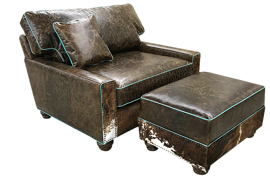 Great Blue Heron's Salado Medium Ottoman 34" x 24" is upholstered using our distressed Buffalo leather and accented with tri color cowhide and turquoise welt. Shown With matching chair and a half