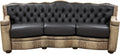 Black leather tufted western cowhide sofa with wicker armrests on a white background