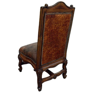 The Matador Dining Chair combines embossed full-grain leather, hand-carved hardwood, and Spanish Colonial artistry. A luxurious Western dining chair handcrafted for beauty, comfort, and endurance. Fully customizable and guaranteed for life.