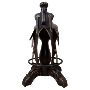 The Mustang Saddle Barstool features embossed turquoise leather, full-grain leather panels, and a hand-forged medallion on a 180° swivel wood base. A handcrafted Western saddle barstool celebrating the artistry and heritage of the American West.