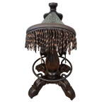 The Mustang Saddle Barstool features embossed turquoise leather, full-grain leather panels, and a hand-forged medallion on a 180° swivel wood base. A handcrafted Western saddle barstool celebrating the artistry and heritage of the American West.