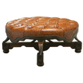 Handcrafted Western ottoman with hand-tooled leather, deep tufting, and carved wood base. The Dominante Ottoman blends rustic elegance with timeless craftsmanship. Customizable.