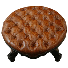 Load image into Gallery viewer, Handcrafted Western ottoman with hand-tooled leather, deep tufting, and carved wood base. The Dominante Ottoman blends rustic elegance with timeless craftsmanship. Customizable.