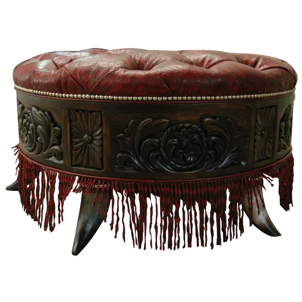 Handcrafted red leather ottoman with carved wood base, nailhead trim, and fringe detailing. The Coronado Ottoman blends Western luxury with timeless artisan craftsmanship.