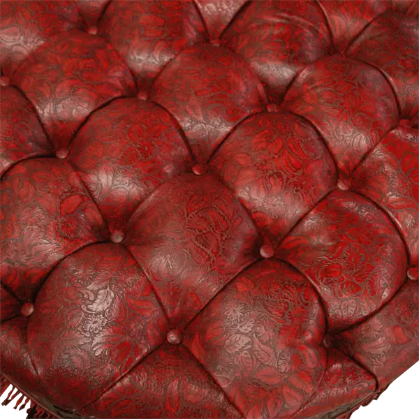 Handcrafted red leather ottoman with carved wood base, nailhead trim, and fringe detailing. The Coronado Ottoman blends Western luxury with timeless artisan craftsmanship.