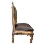 The Picador Dining Chair features full-grain leather upholstery, embossed floral detailing, and hand-carved hardwood. A Spanish Colonial-inspired dining chair blending Western luxury with artisanal craftsmanship. 100% customizable and guaranteed for life.