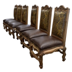The Picador Dining Chair features full-grain leather upholstery, embossed floral detailing, and hand-carved hardwood. A Spanish Colonial-inspired dining chair blending Western luxury with artisanal craftsmanship. 100% customizable and guaranteed for life.