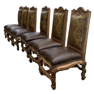 The Picador Dining Chair features full-grain leather upholstery, embossed floral detailing, and hand-carved hardwood. A Spanish Colonial-inspired dining chair blending Western luxury with artisanal craftsmanship. 100% customizable and guaranteed for life.