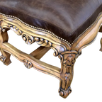 The Picador Dining Chair features full-grain leather upholstery, embossed floral detailing, and hand-carved hardwood. A Spanish Colonial-inspired dining chair blending Western luxury with artisanal craftsmanship. 100% customizable and guaranteed for life.