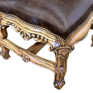 The Picador Dining Chair features full-grain leather upholstery, embossed floral detailing, and hand-carved hardwood. A Spanish Colonial-inspired dining chair blending Western luxury with artisanal craftsmanship. 100% customizable and guaranteed for life.