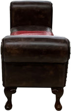 Brown leather 60 inch roll arm bench with an authentic red ostrich hide saddle style insert on the seat cushion