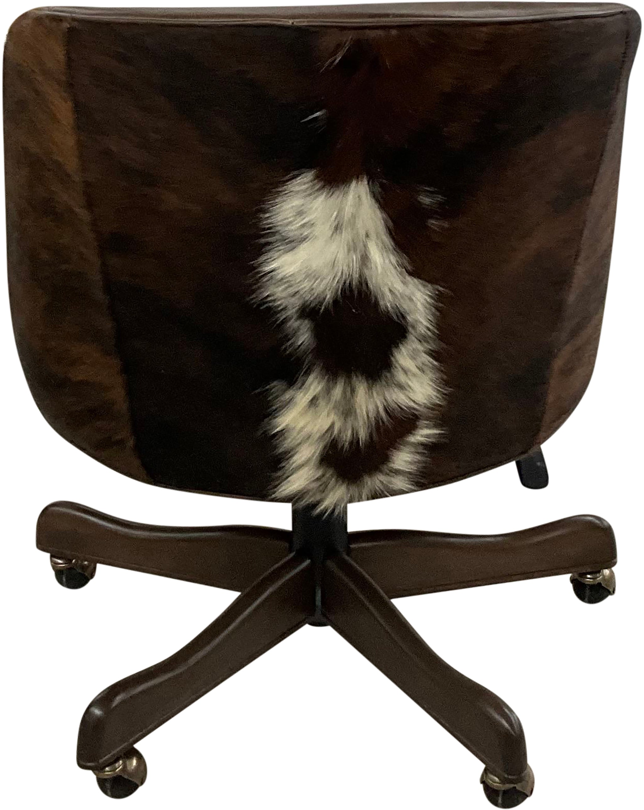 Western swivel office chair in Kodiak Bear leather with dark exotic cowhide wraparound back and white hide accents. Luxury ranch office seating with handcrafted style.