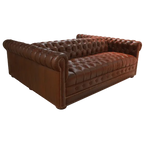 Handcrafted full-grain leather double sofa with Western button tufting and solid wood frame. The Paciente blends rugged luxury and timeless craftsmanship. 100% customizable.