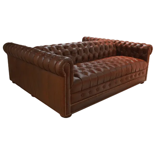 Handcrafted full-grain leather double sofa with Western button tufting and solid wood frame. The Paciente blends rugged luxury and timeless craftsmanship. 100% customizable.