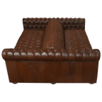 Handcrafted full-grain leather double sofa with Western button tufting and solid wood frame. The Paciente blends rugged luxury and timeless craftsmanship. 100% customizable.