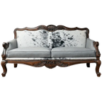 Handcrafted Western-style sofa with carved wood frame, full-grain leather, and cowhide upholstery. The Lords Sofa blends rustic charm with elegant Spanish Colonial design. Fully Customizable.