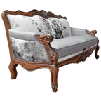 Handcrafted Western-style sofa with carved wood frame, full-grain leather, and cowhide upholstery. The Lords Sofa blends rustic charm with elegant Spanish Colonial design. Fully Customizable.