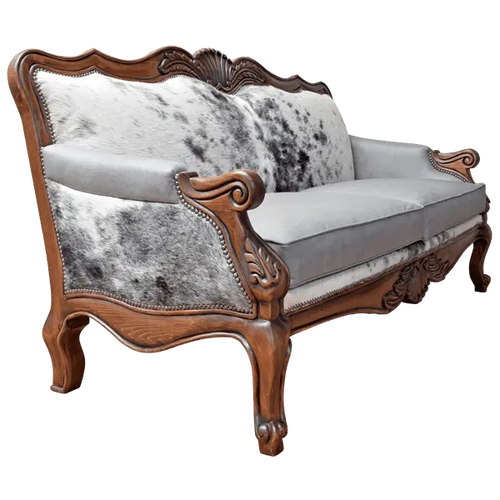 Handcrafted Western-style sofa with carved wood frame, full-grain leather, and cowhide upholstery. The Lords Sofa blends rustic charm with elegant Spanish Colonial design. Fully Customizable.
