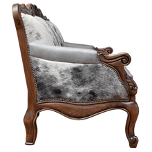 Load image into Gallery viewer, Handcrafted Western-style sofa with carved wood frame, full-grain leather, and cowhide upholstery. The Lords Sofa blends rustic charm with elegant Spanish Colonial design. Fully Customizable.