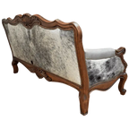 Handcrafted Western-style sofa with carved wood frame, full-grain leather, and cowhide upholstery. The Lords Sofa blends rustic charm with elegant Spanish Colonial design. Fully Customizable.
