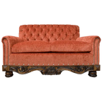 Handcrafted Western loveseat with carved wood base, rust-toned fabric, and tufted backrest. The Durango Loveseat blends rustic warmth with refined craftsmanship. Customizable.