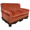 Handcrafted Western loveseat with carved wood base, rust-toned fabric, and tufted backrest. The Durango Loveseat blends rustic warmth with refined craftsmanship. Customizable.