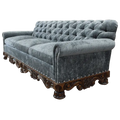 Handcrafted Western-style sofa with deep tufting, carved wood base, and customizable upholstery. The Hidalgo Sofa blends rustic elegance with heirloom craftsmanship.