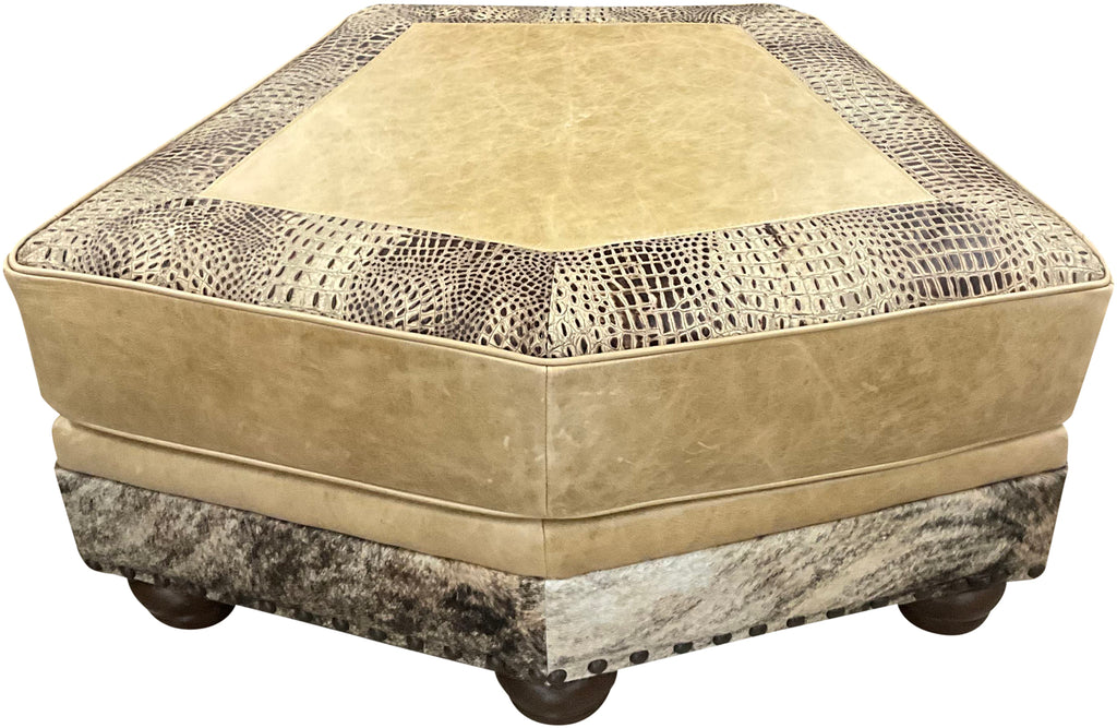 Hexagonal ottoman with textured beige top and patterned base on a white background, called palomino theater ottoman