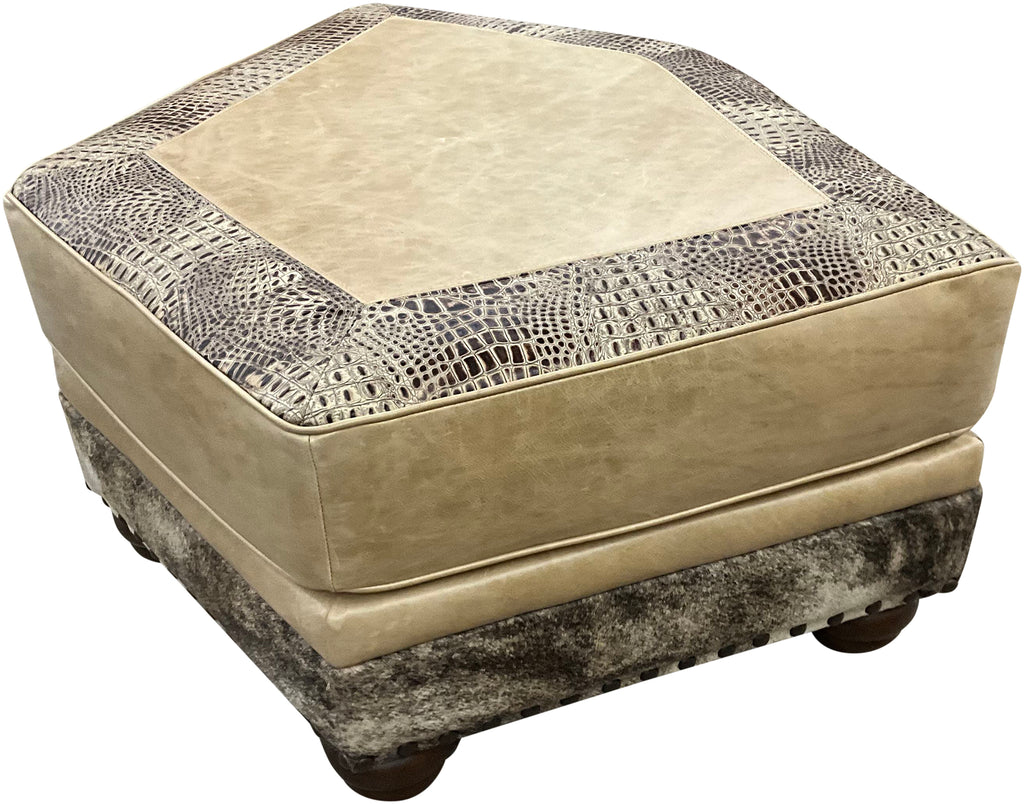 Hexagonal ottoman with textured beige top and patterned base on a white background, called palomino theater ottoman