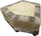 Hexagonal ottoman with textured beige top and patterned base on a white background, called palomino theater ottoman