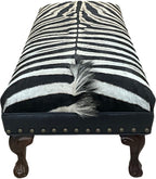 Luxury zebra hide bench with authentic zebra hide seat, Fendi Night leather rail, nailhead trim, and traditional ball-and-claw wood frame. Exotic statement bench 60".
