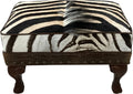Luxury zebra hide ottoman with authentic zebra hide and mane top, Gator Walnut leather rail, nailhead trim, and carved wood legs. Western safari accent stool 27" x 17".